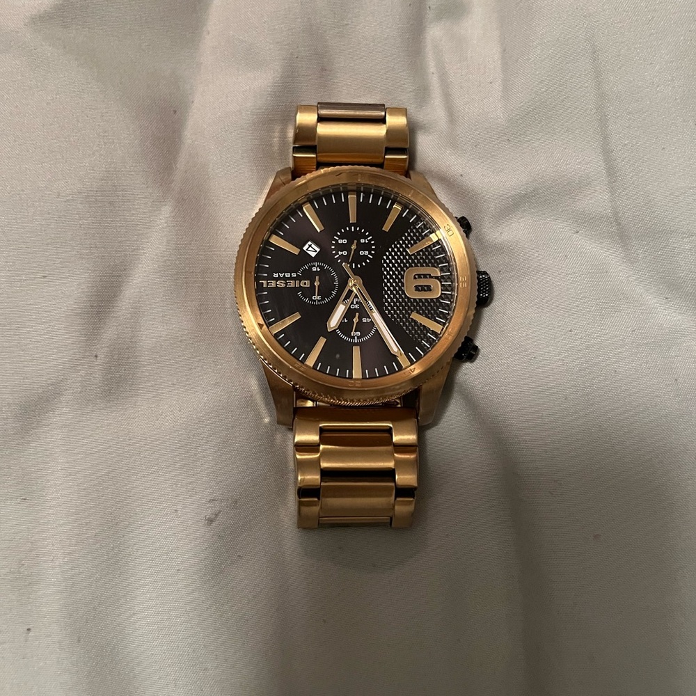 Black and gold diesel watch